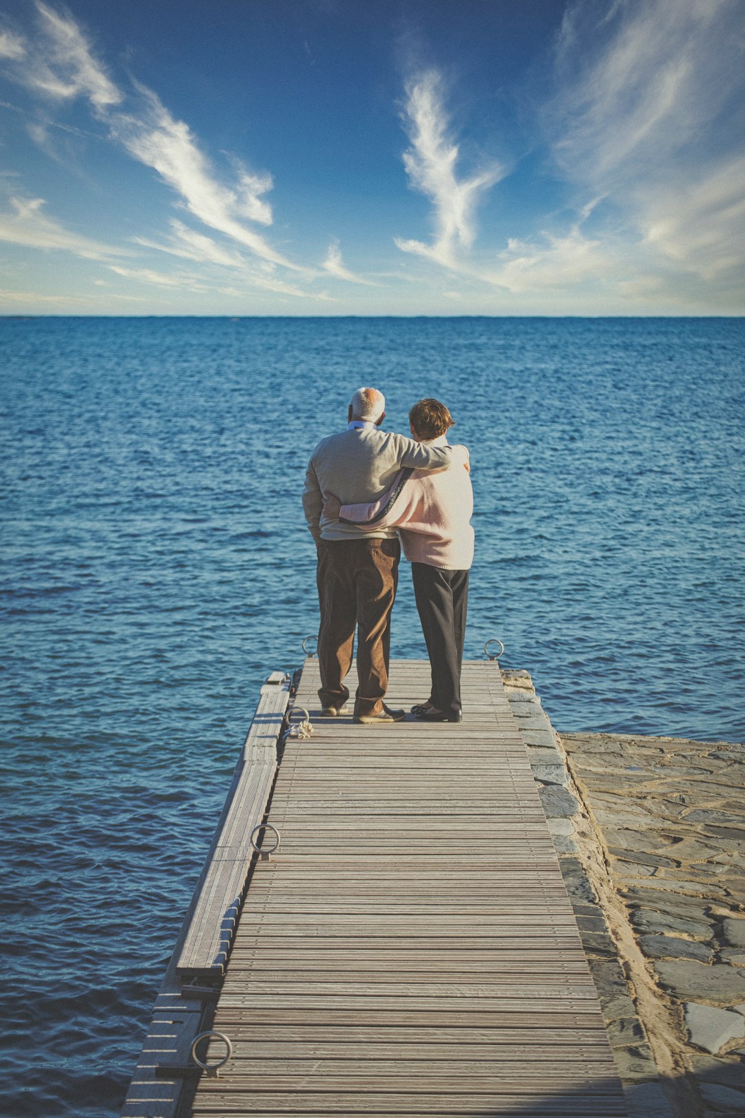 Retired couple contemplating the sea